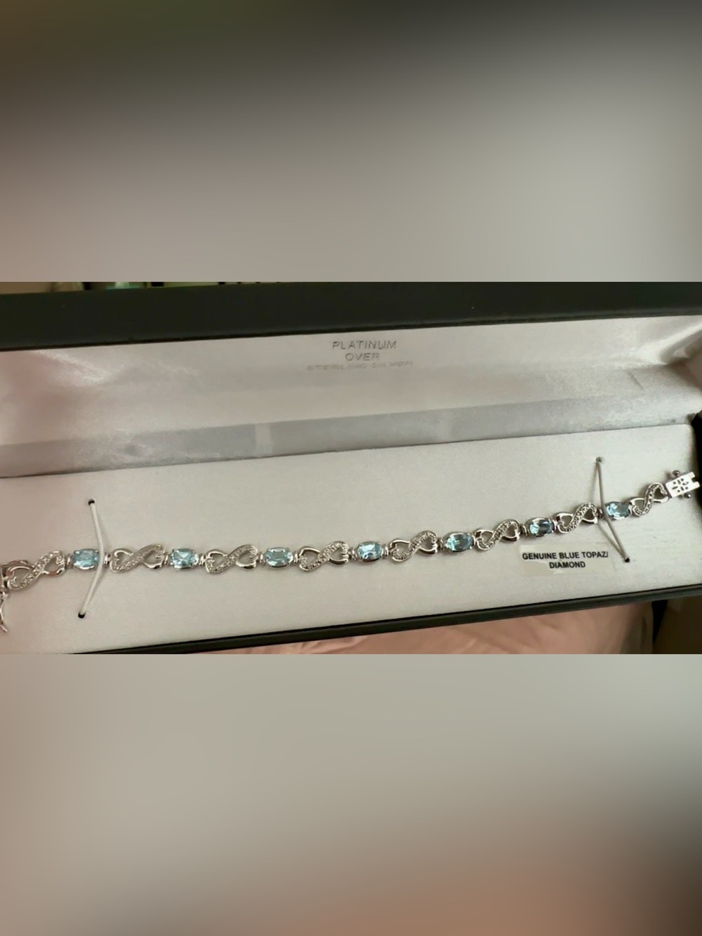 Oval Cut Blue Topaz Infinity Link Bracelet